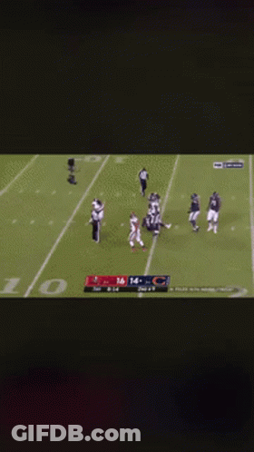 A Football Player Kneeling On The Field With The Number 16 On His Jersey GIF