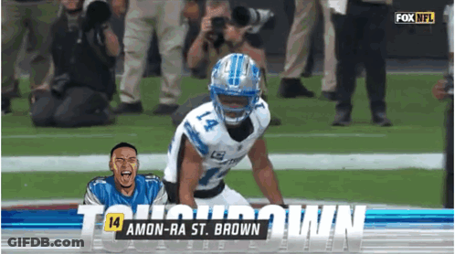 A Football Player Named Amon-Ra St. Brown Is Kneeling Down On The Field GIF