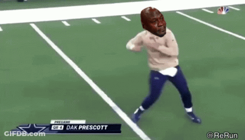 A Football Player Named Dak Prescott Is Running On The Field During A Game GIF
