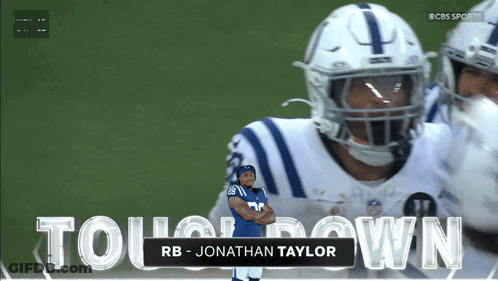 A Football Player Named Jonathan Taylor Is Standing In Front Of A Large Screen GIF