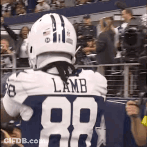 A Football Player Named Lamb Wearing A White Helmet And Number 88 Jersey GIF