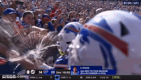 A Football Player Named S. Diggs Is Being Sprayed With Water GIF