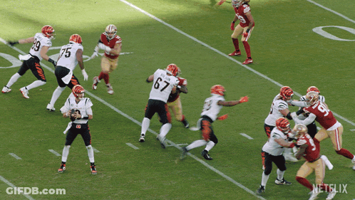 A Football Player Running On A Field With A Netflix Logo GIF