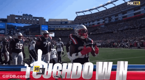 A Football Player Stands On The Field With The Words Touchdown N GIF