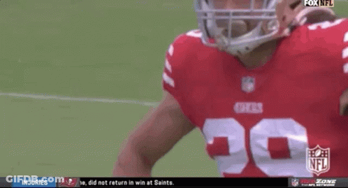 A Football Player Wearing A 49Ers Jersey Stands On The Field GIF