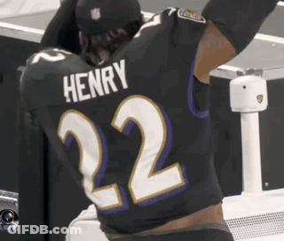 A Football Player Wearing A Black Jersey With The Name Henry On The Back GIF