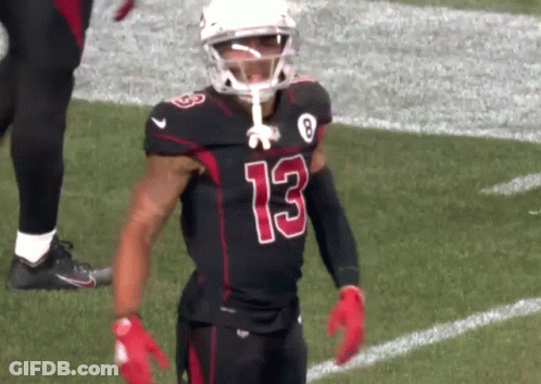 A Football Player Wearing A Black Jersey With The Number 13 On It GIF