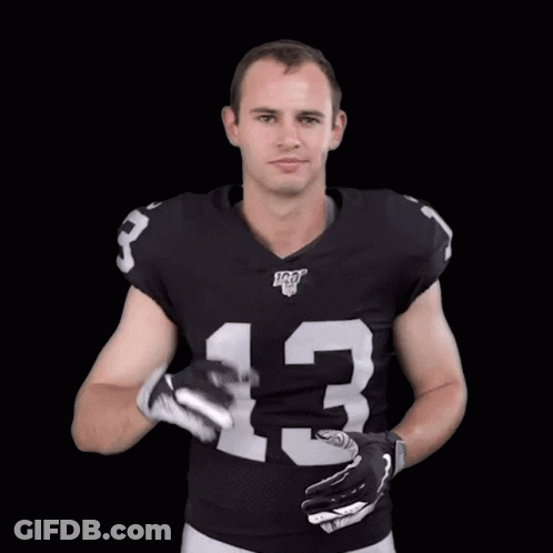 A Football Player Wearing A Black Jersey With The Number 13 On It GIF