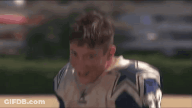 A Football Player Wearing A Blue And White Jersey With The Number 31 On It Is Smiling . GIF