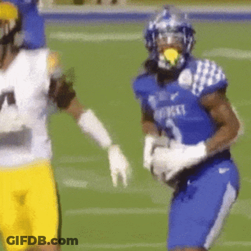 A Football Player Wearing A Blue Jersey That Says Kentucky GIF