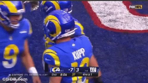 A Football Player Wearing A Blue Jersey With The Name Kupp On It GIF
