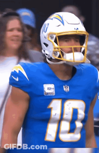 A Football Player Wearing A Blue Jersey With The Number 10 GIF