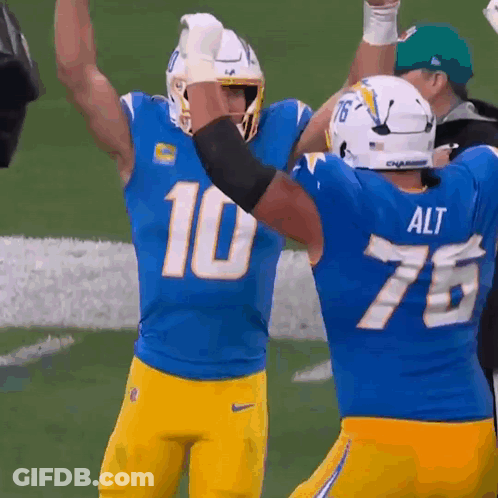 A Football Player Wearing A Blue Jersey With The Number 10 GIF