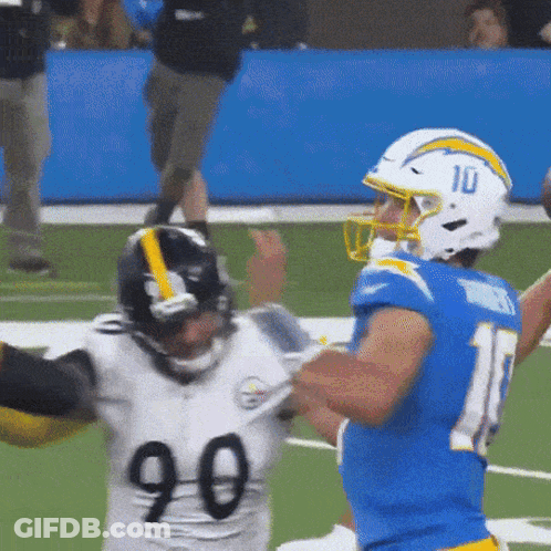 A Football Player Wearing A Blue Jersey With The Number 10 On His Helmet GIF