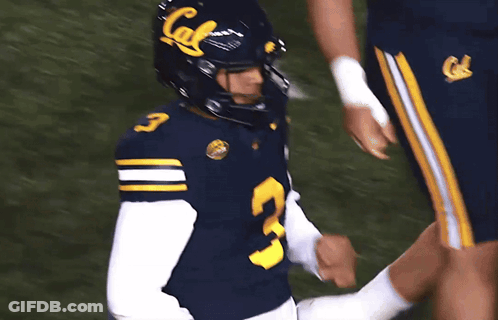 A Football Player Wearing A Blue Jersey With The Number 3 GIF
