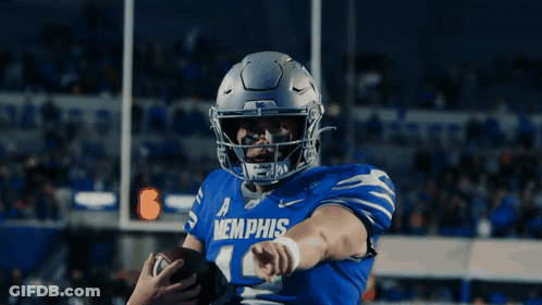 A Football Player Wearing A Blue Memphis Jersey GIF