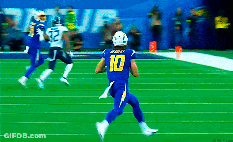 A Football Player Wearing A Blue Uniform With The Number 10 On It GIF