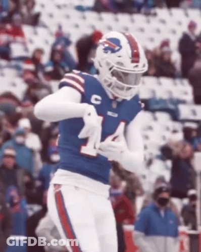 A Football Player Wearing A Buffalo Bills Uniform Is Running On A Field . GIF