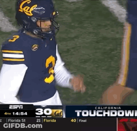 A Football Player Wearing A California Jersey Talks To Another Player GIF