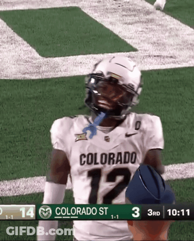 A Football Player Wearing A Colorado Jersey Is Standing On The Field GIF