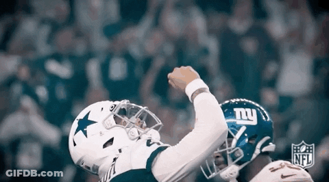 A Football Player Wearing A Cowboys Jersey And A New York Giants Helmet Celebrates A Touchdown . GIF