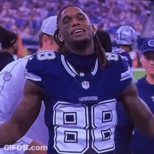 A Football Player Wearing A Cowboys Jersey With The Number 88 On It GIF