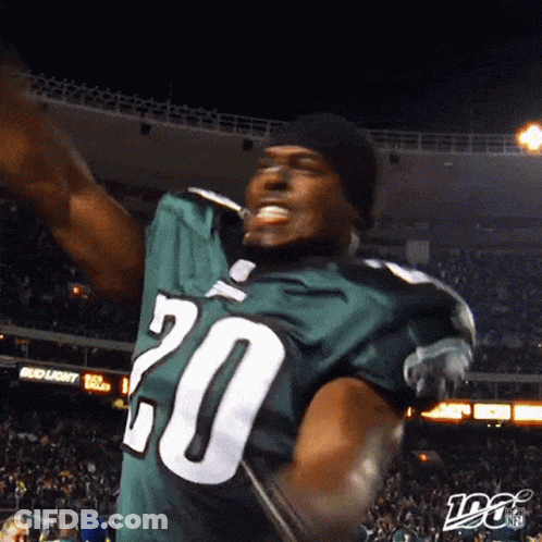 A Football Player Wearing A Green Jersey With The Number 20 GIF
