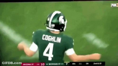 A Football Player Wearing A Green Jersey With The Number 4 On It GIF