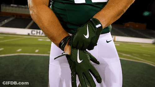 A Football Player Wearing A Green Nike Glove GIF