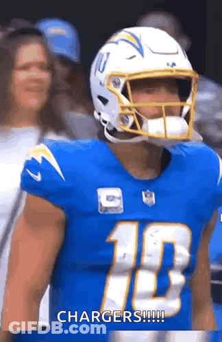 A Football Player Wearing A Helmet And A Blue Jersey With The Number 10 On It . GIF