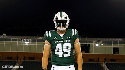 A Football Player Wearing A Helmet And A Jersey That Says Charlotte On It GIF