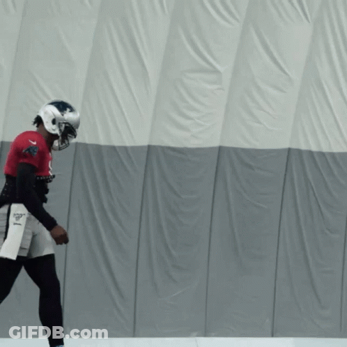 A Football Player Wearing A Helmet And A Jersey That Says Patriots On It GIF