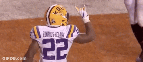 A Football Player Wearing A Helmet And A Jersey With The Number 22 On It . GIF