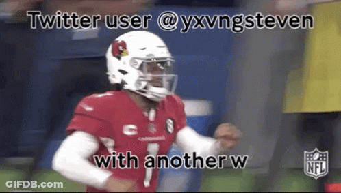 A Football Player Wearing A Helmet And A Red Jersey Is Running On A Field . GIF