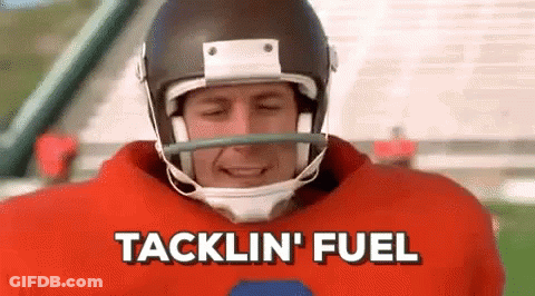 A Football Player Wearing A Helmet And A Red Jersey Is Talking About Tacklin ' Fuel . GIF