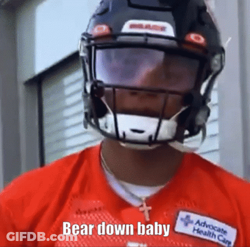 A Football Player Wearing A Helmet And A Red Shirt Says Bear Down Baby . GIF