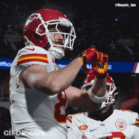 A Football Player Wearing A Helmet And Gloves With The Number 87 On Them GIF