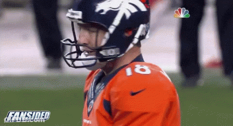 A Football Player Wearing A Helmet And Jersey With The Number 18 On It GIF