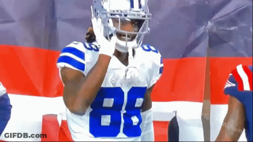A Football Player Wearing A Helmet And Jersey With The Number 88 On It GIF