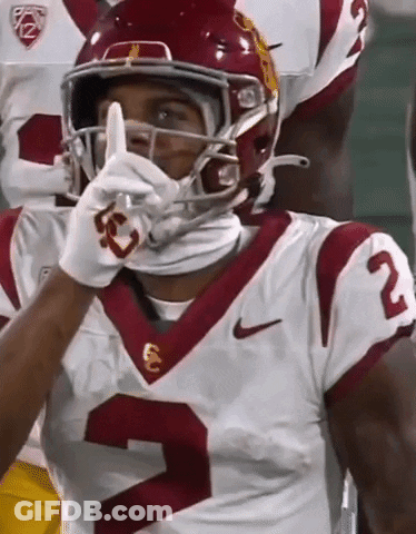 A Football Player Wearing A Helmet And Number 2 On His Jersey GIF
