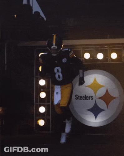 A Football Player Wearing A Helmet And Number 8 On His Jersey GIF