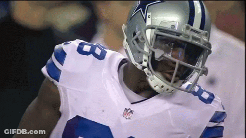 A Football Player Wearing A Helmet That Has A Star On It GIF