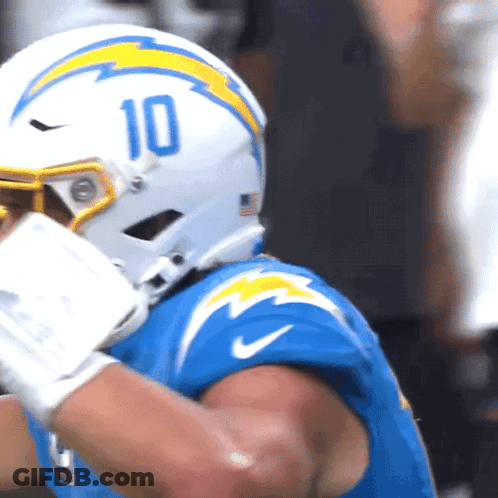 A Football Player Wearing A Helmet That Says 10 GIF