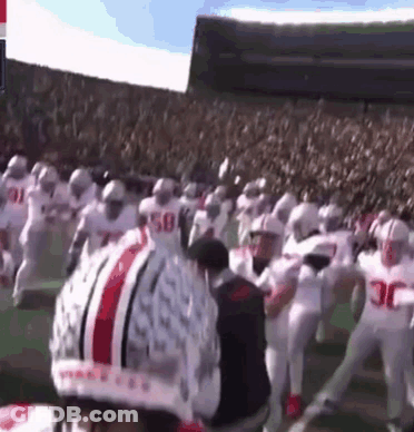 A Football Player Wearing A Helmet That Says Ohio State On It GIF