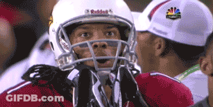 A Football Player Wearing A Helmet That Says Riddell GIF
