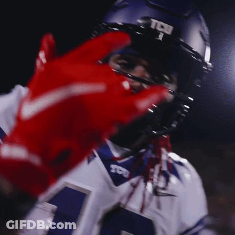 A Football Player Wearing A Helmet That Says Tcj On It GIF