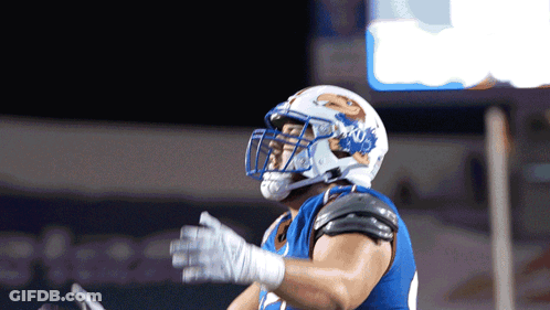 A Football Player Wearing A Helmet That Says Ucsd GIF