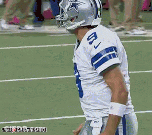A Football Player Wearing A Helmet With A Star On It And The Number 8 On His Jersey GIF