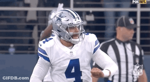 A Football Player Wearing A Helmet With A Star On It Is Running On The Field . GIF