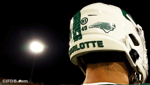 A Football Player Wearing A Helmet With Charlotte On It GIF